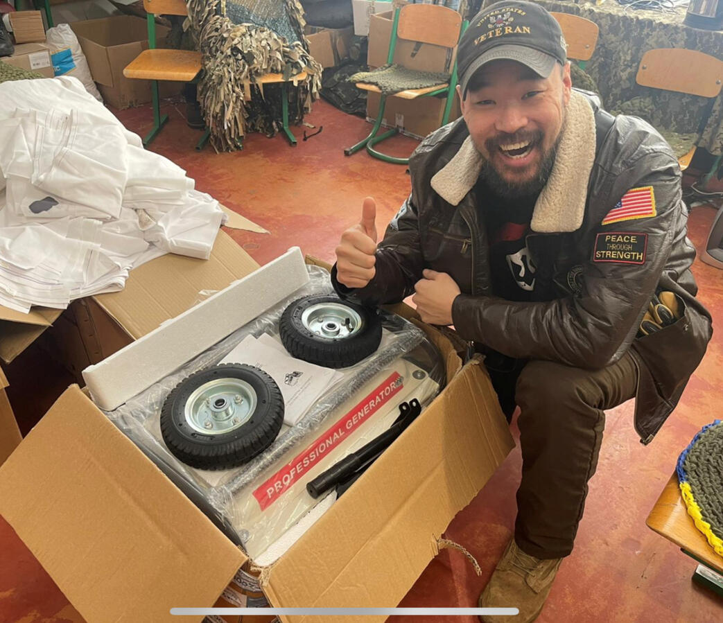 Mark J. Lindquist pictured with a generator donated to the Ukrainian Army